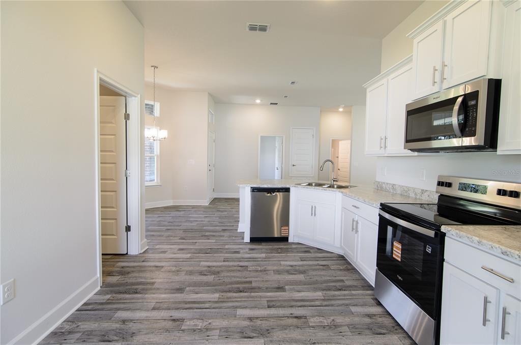 30 Priory Lane Palm Coast, FL 32164 - Photo 8 of 31 a kitchen with a sink and steel appliances