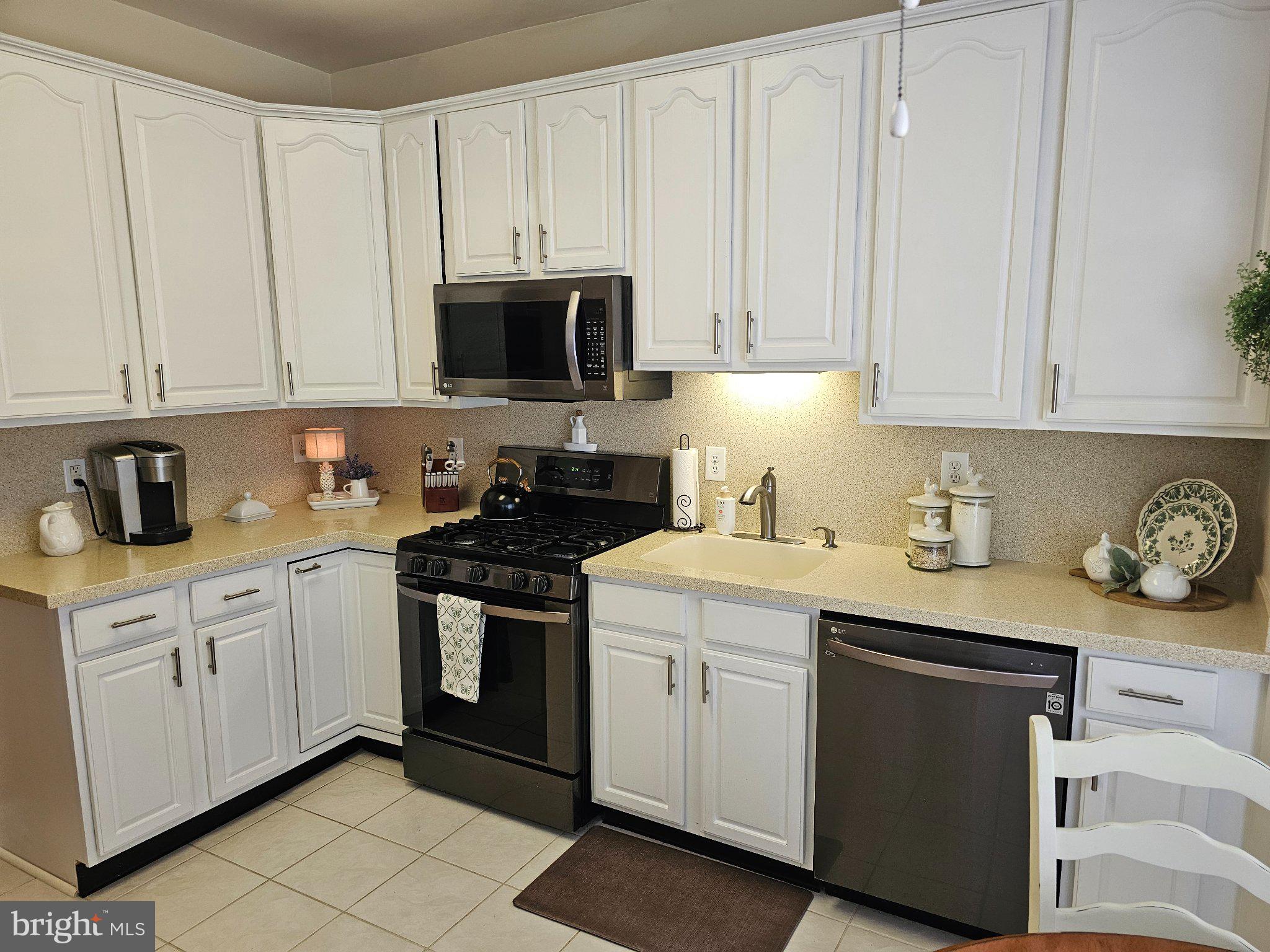 25 Chickadee Way Hamilton, NJ 08690 - Photo 11 of 26 a kitchen with stainless steel appliances granite countertop white cabinets a sink and dishwasher