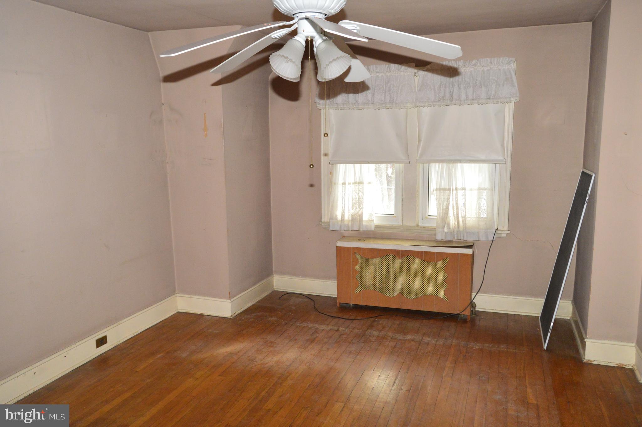 304 North 25th Street Reading, PA 19606 - Photo 13 of 31 a view of an empty room with wooden floor and a window