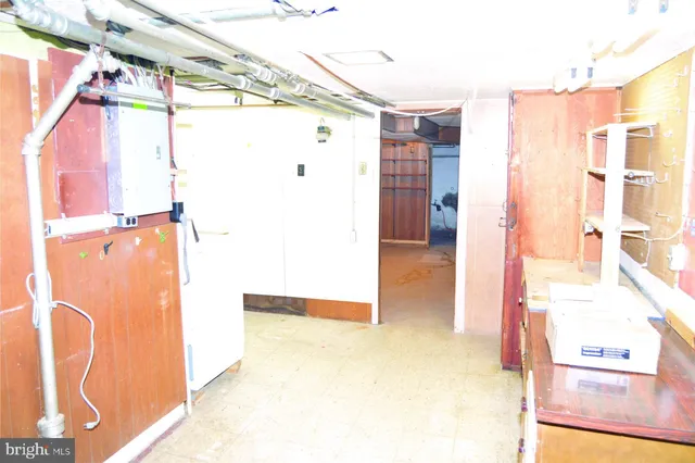 a view of a house with wooden fence