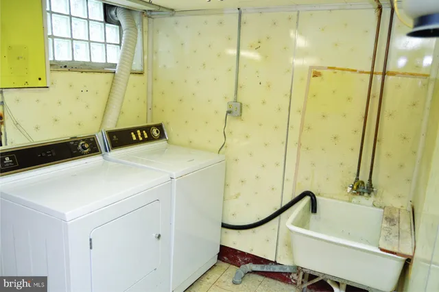 a picture of a bathroom with a shower