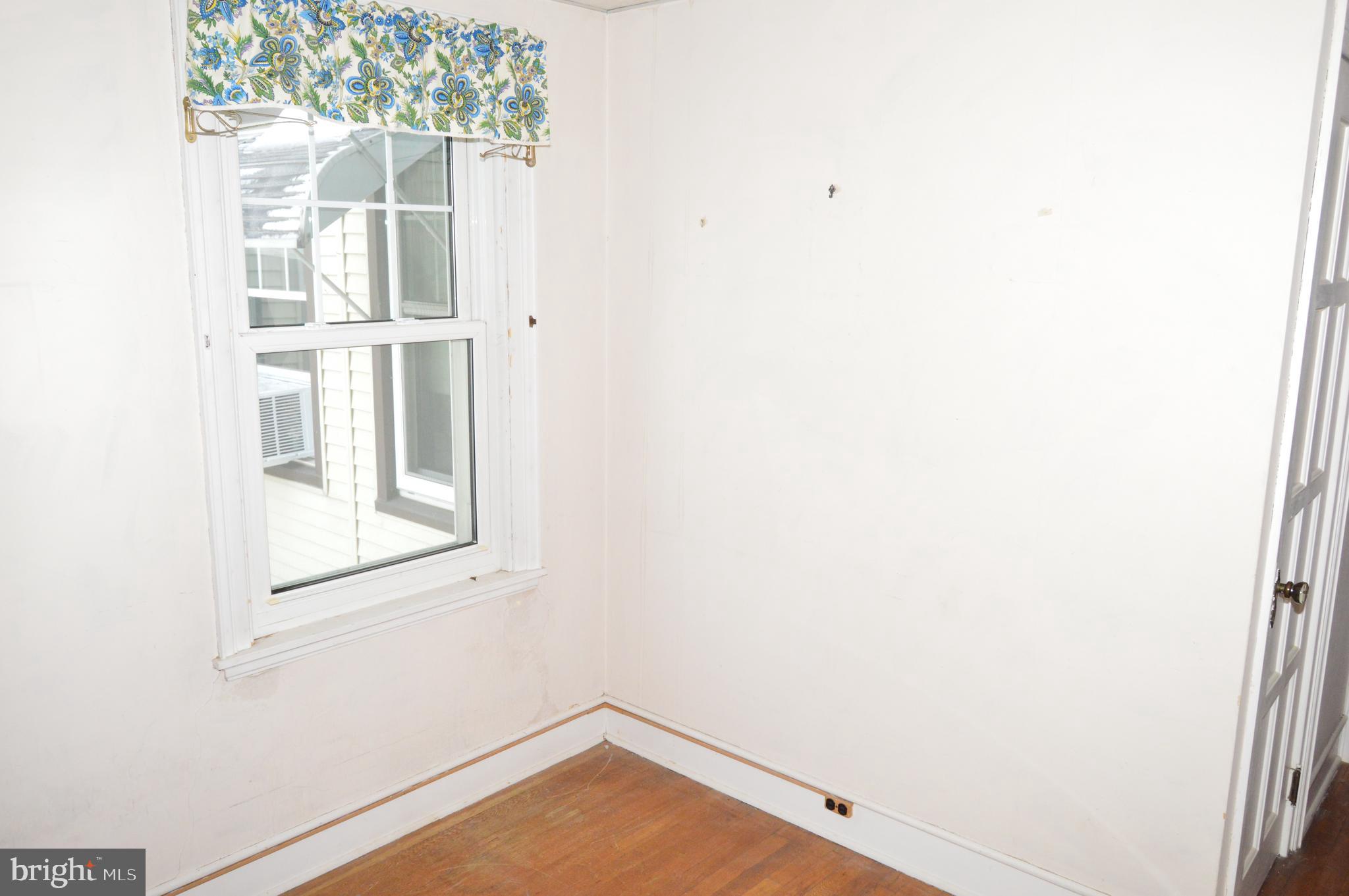 304 North 25th Street Reading, PA 19606 - Photo 19 of 31 a view of a small space with wooden floor and a window