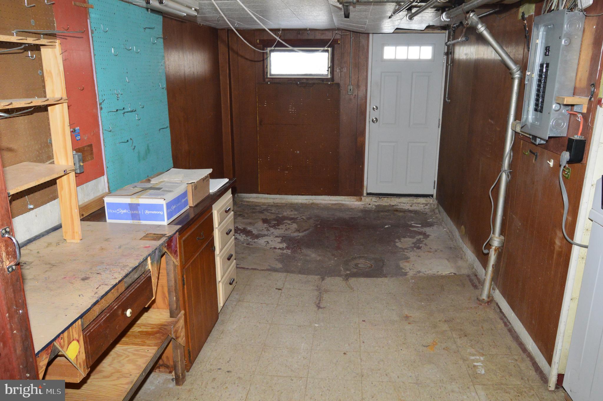 304 North 25th Street Reading, PA 19606 - Photo 22 of 31 a bathroom with a granite countertop sink a mirror and shower