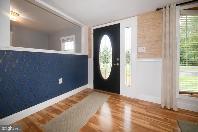 a spacious bedroom with a bed and a window