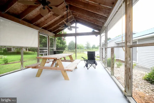 a view of an house with backyard space and balcony
