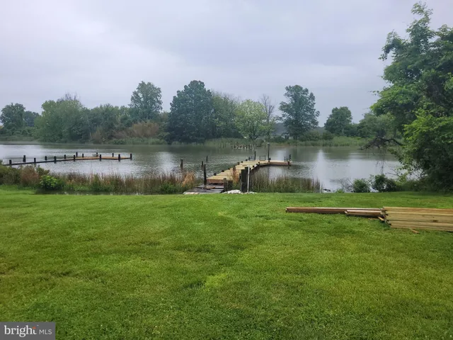 a living room with a fireplace and a flat screen tv