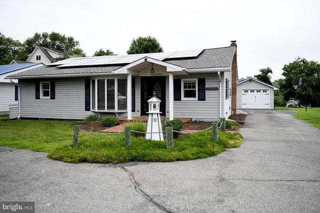 a view of a house with a small yard