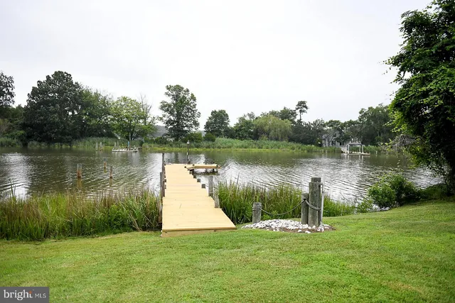 a view of outdoor space with deck and yard