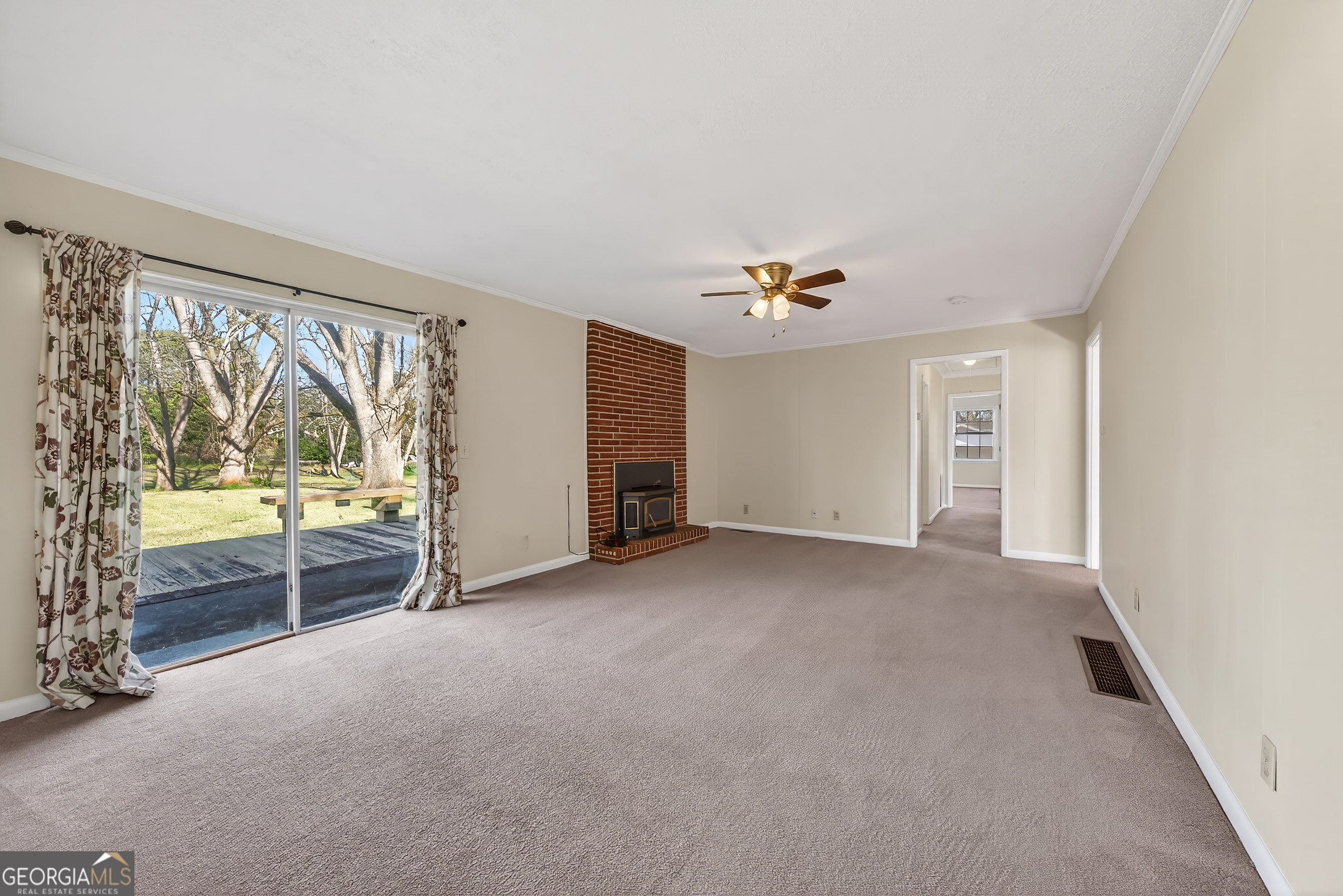741 East Avenue Madison, GA 30650 - Photo 16 of 40 a view of an empty room with a window