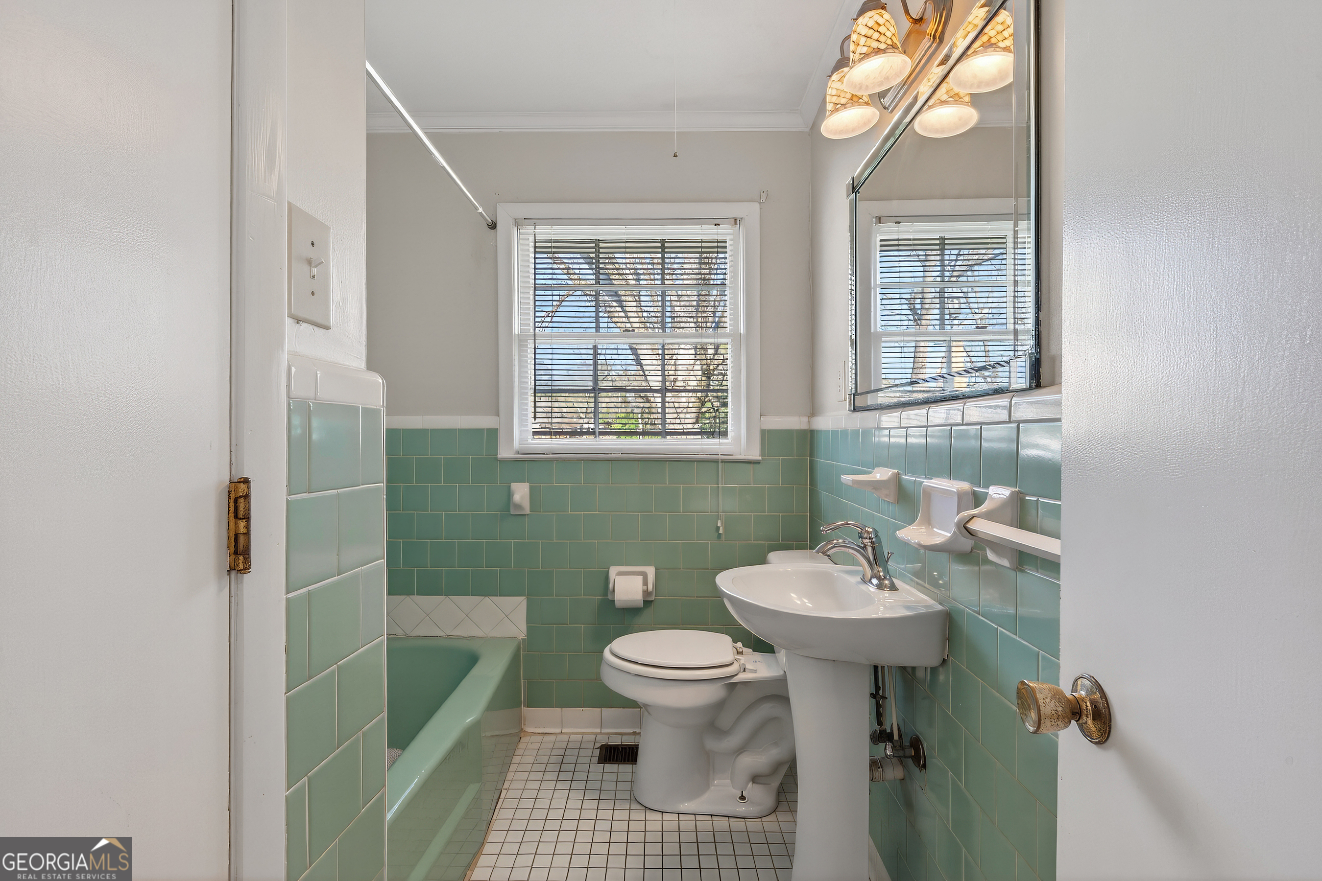 741 East Avenue Madison, GA 30650 - Photo 20 of 40 a bathroom with a sink toilet and a mirror