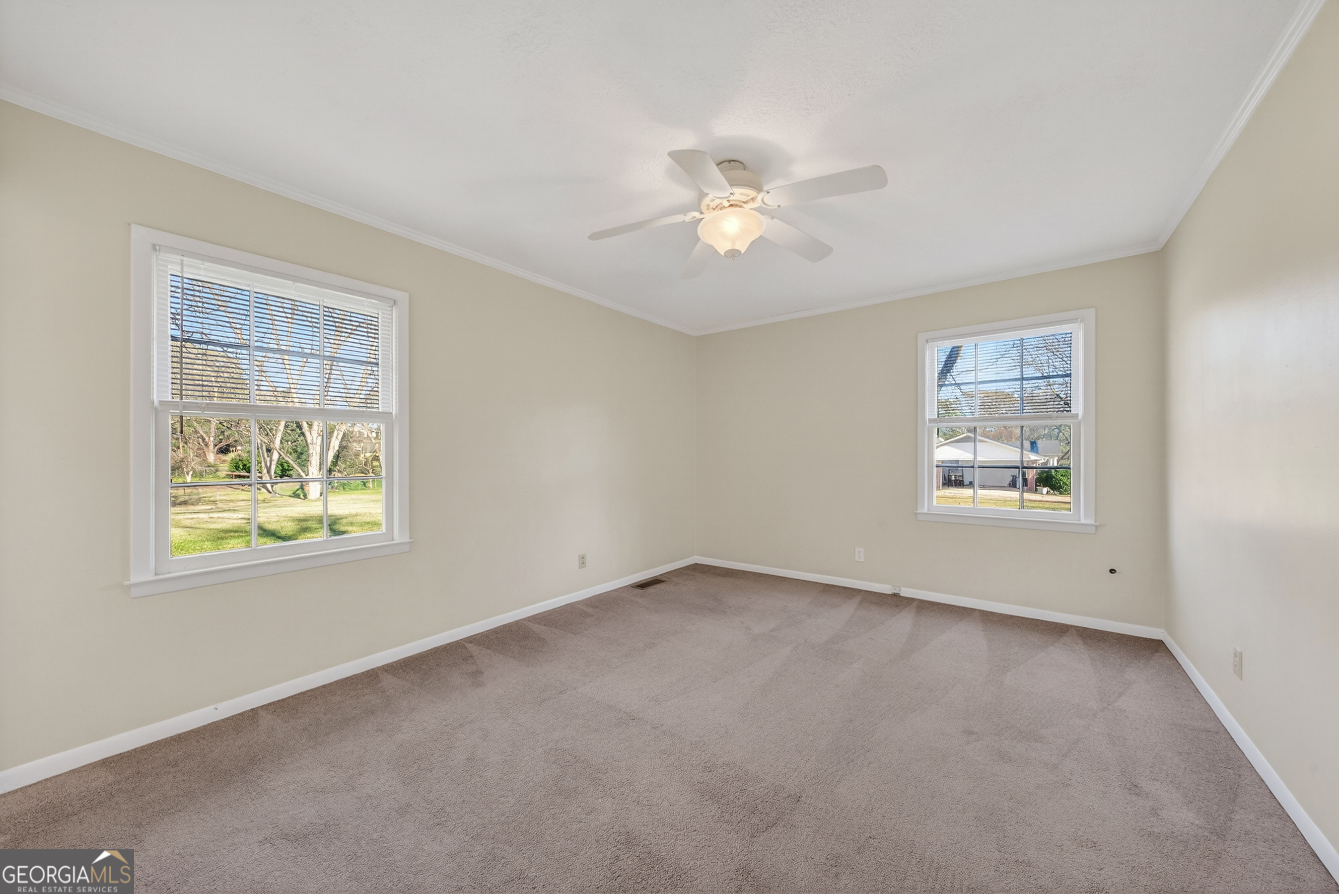 741 East Avenue Madison, GA 30650 - Photo 21 of 40 a view of an empty room with a window