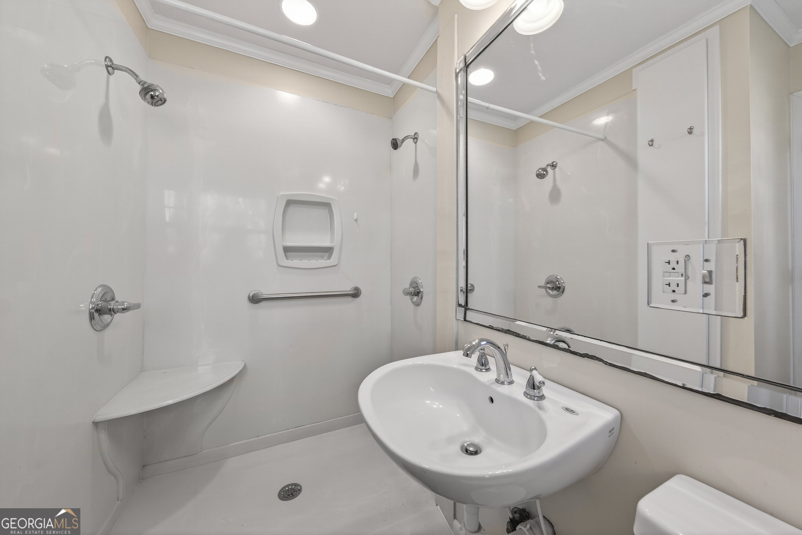 741 East Avenue Madison, GA 30650 - Photo 23 of 40 a bathroom with a sink a toilet and shower