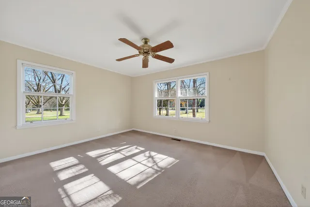 a view of empty room with windows