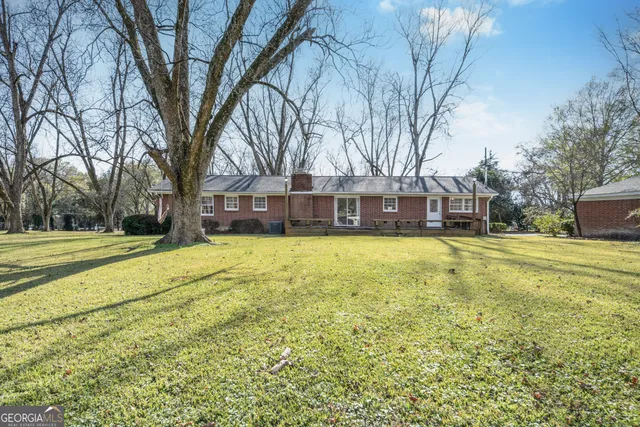 a view of a house with a big yard