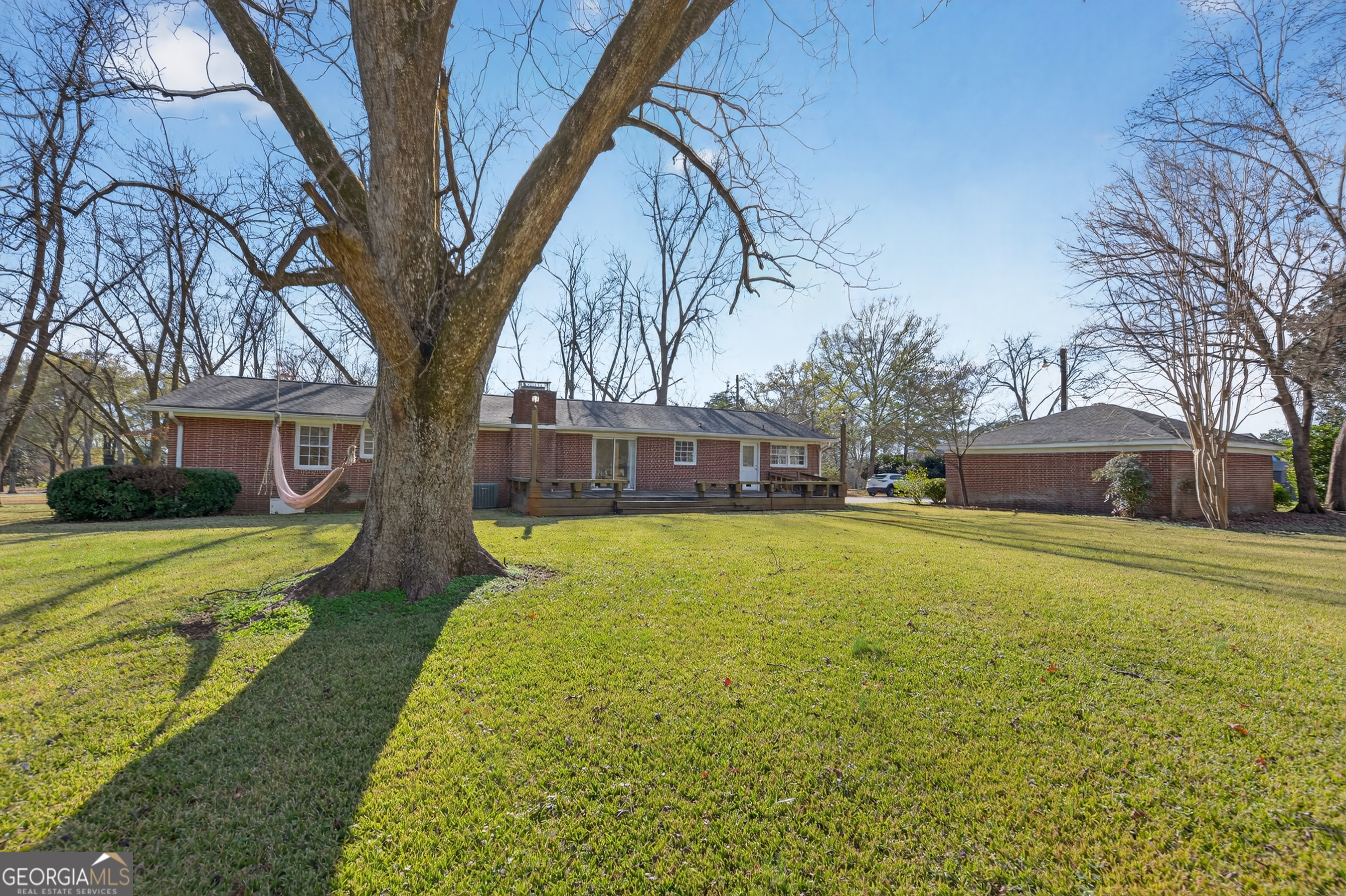 741 East Avenue Madison, GA 30650 - Photo 34 of 40 a house with trees in front of it