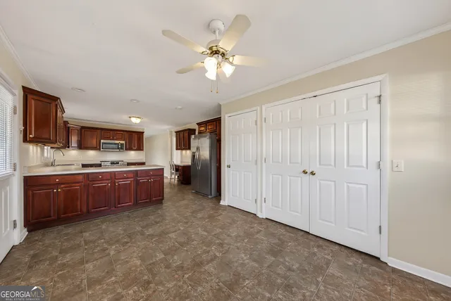 a large kitchen with a large window in it and kitchen island