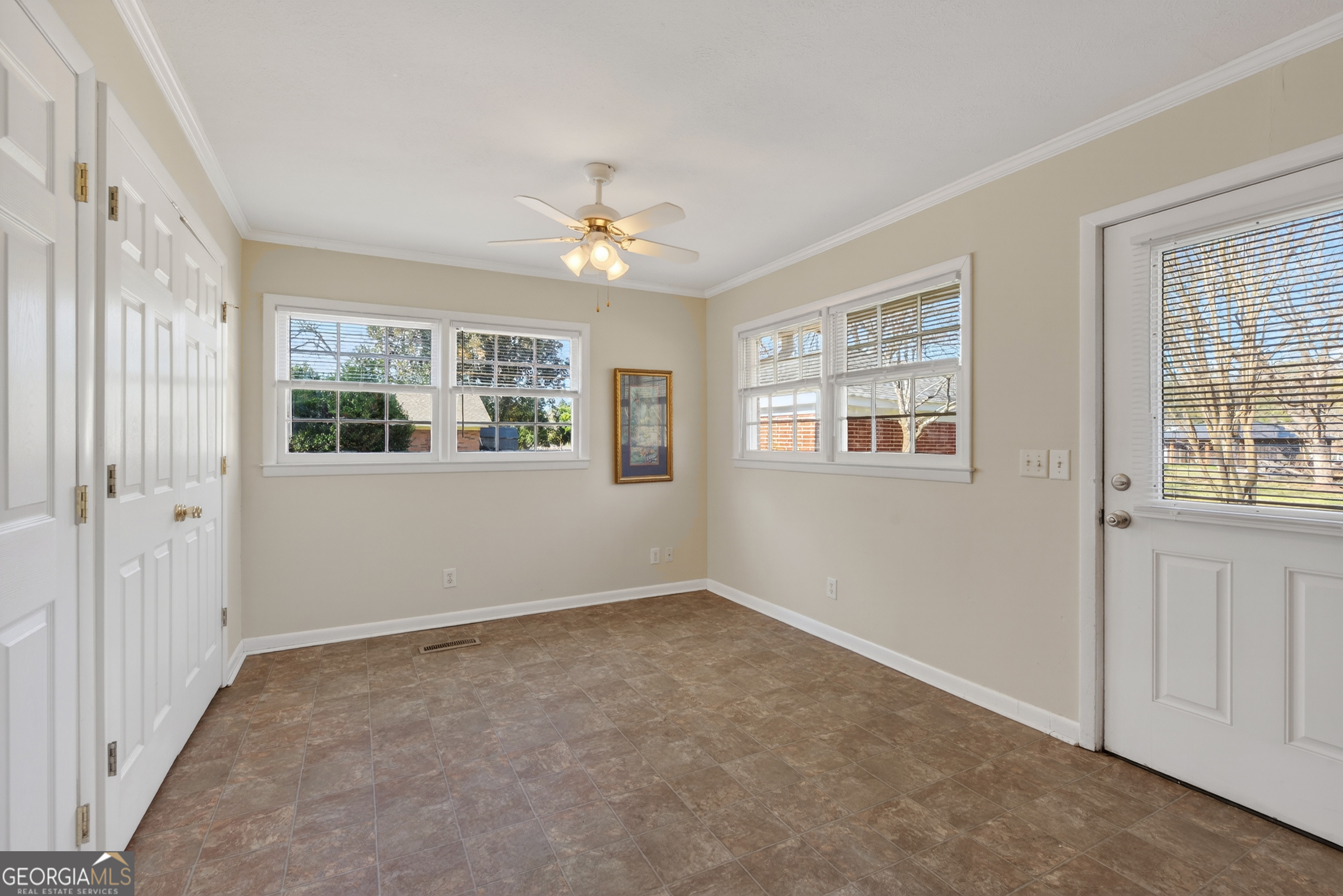 741 East Avenue Madison, GA 30650 - Photo 9 of 40 a view of an empty room with a window