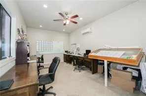 a room with furniture a air conditioner vent and a window