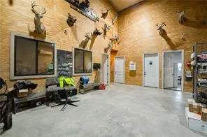 a view of a patio with table and chairs and ice snow