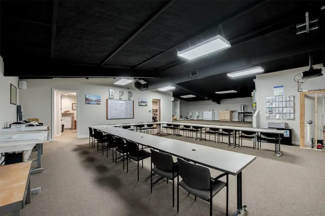 a view of a terrace with outdoor seating and city view
