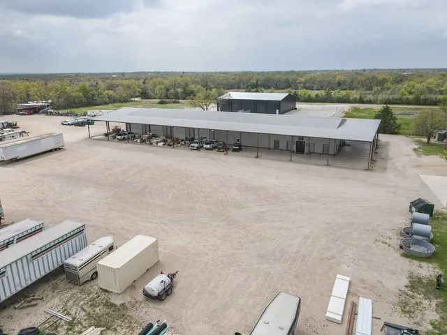 a backyard of a house with lots of green space and plants
