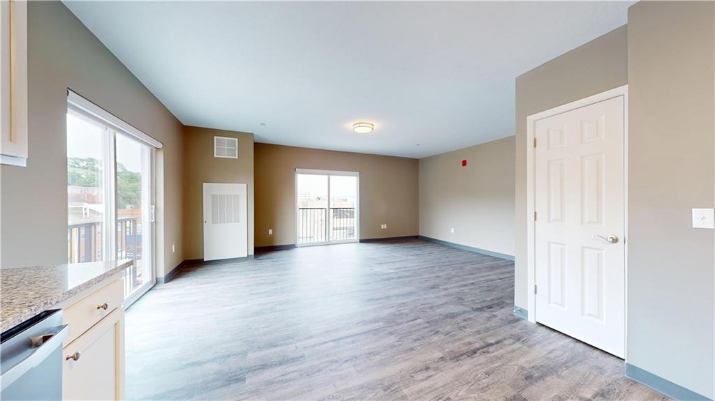 1450 Fifth Avenue, Unit 300 Pittsburgh, PA 15219 - Photo 19 of 24 a view of an empty room with a window and wooden floor