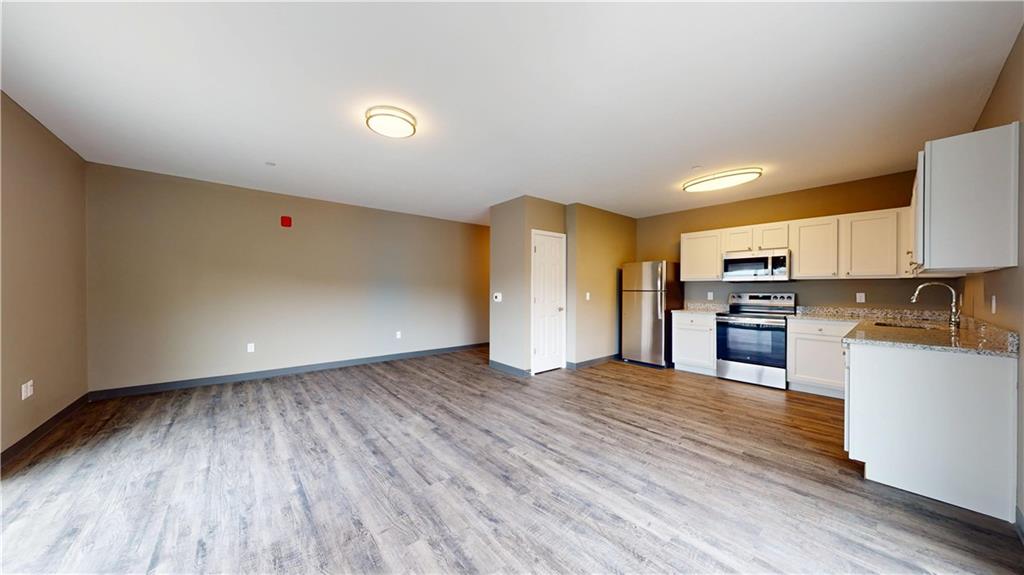 1450 Fifth Avenue, Unit 300 Pittsburgh, PA 15219 - Photo 21 of 24 a view of kitchen view wooden floor and electronic appliances