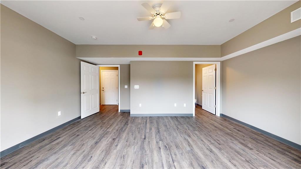 1450 Fifth Avenue, Unit 300 Pittsburgh, PA 15219 - Photo 5 of 24 wooden floor in an empty room with a window