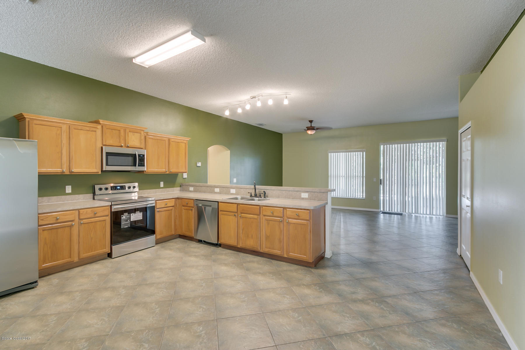 2992 Tishman Road Southeast Palm Bay, FL 32909 - Photo 14 of 28 Kitchen to Family
