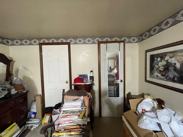 a bedroom with furniture and a window