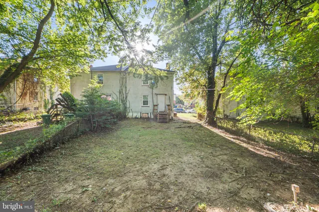 a view of a house with a tree