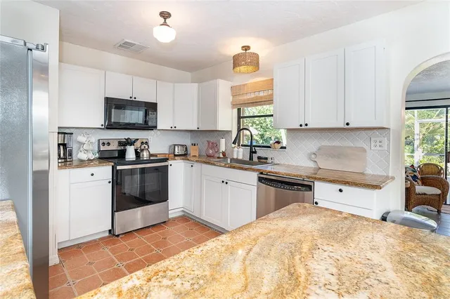 a living room with furniture fireplace and flat screen tv