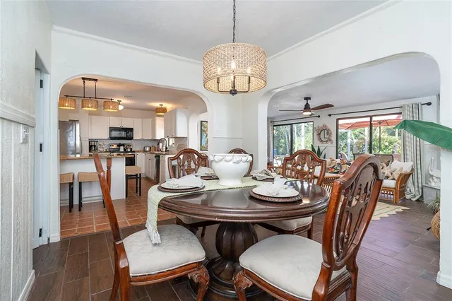 a view of a patio with table and chairs under an umbrella