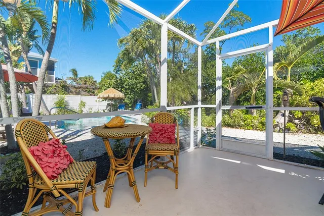 a view of a swimming pool with a patio