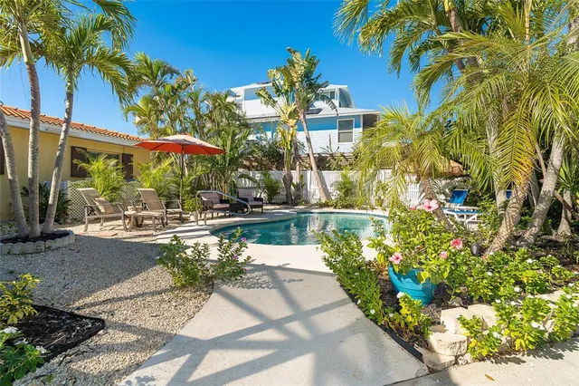 a view of a swimming pool with a patio
