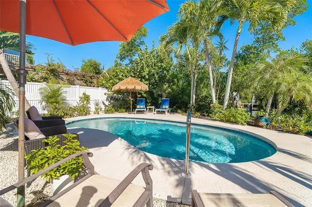 a living room with a bed furniture and a window