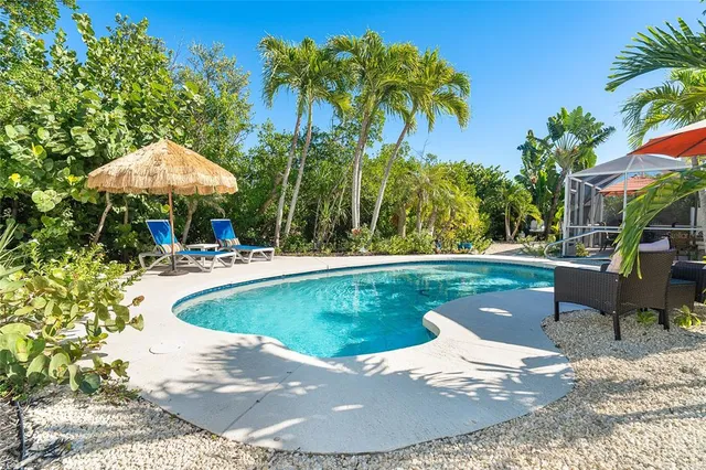 a bedroom with bed and window