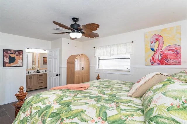 a view of a patio with chairs next to a yard