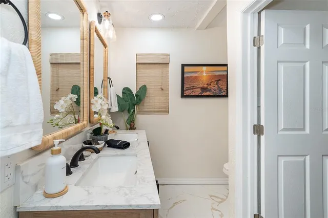 an aerial view of a house with a lake view