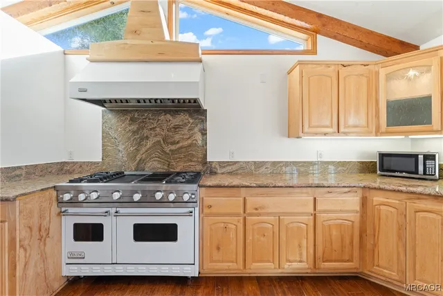 a view of kitchen with wooden floor and cabinet