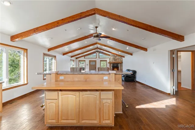 a kitchen with stainless steel appliances granite countertop a sink and cabinets