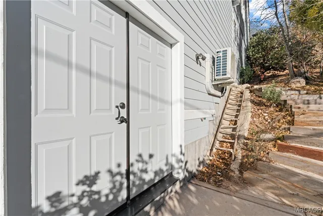 a view of a kitchen with a sink and a refrigerator