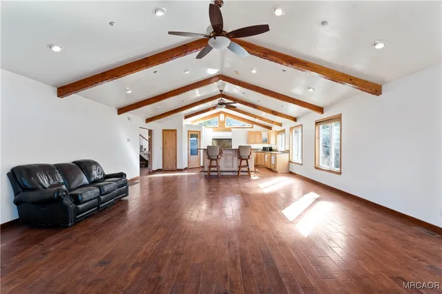 a view of livingroom with fireplace and hardwood floor