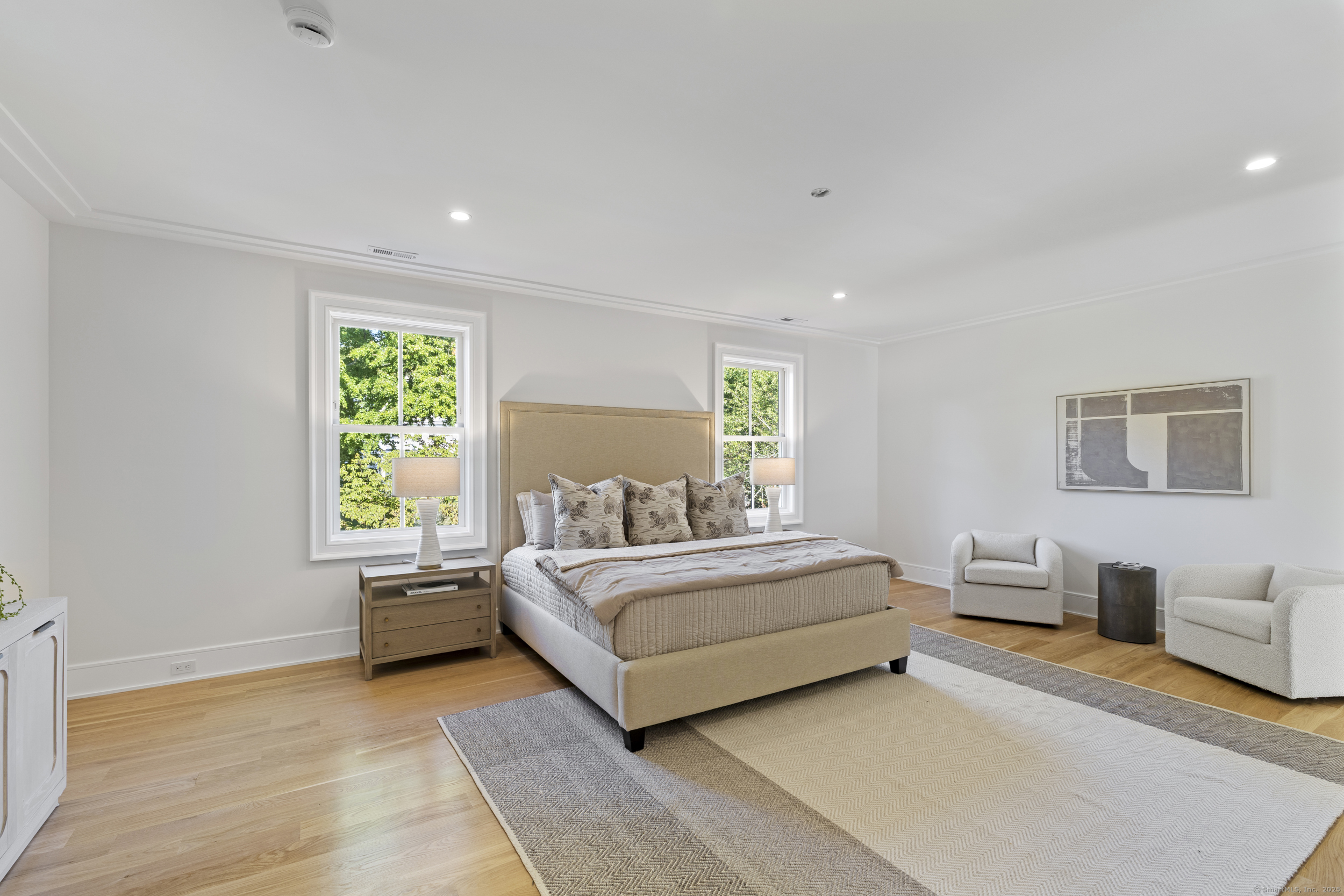 32 Webb Road Westport, CT 06880 - Photo 13 of 40 a spacious bedroom with a bed and a couch