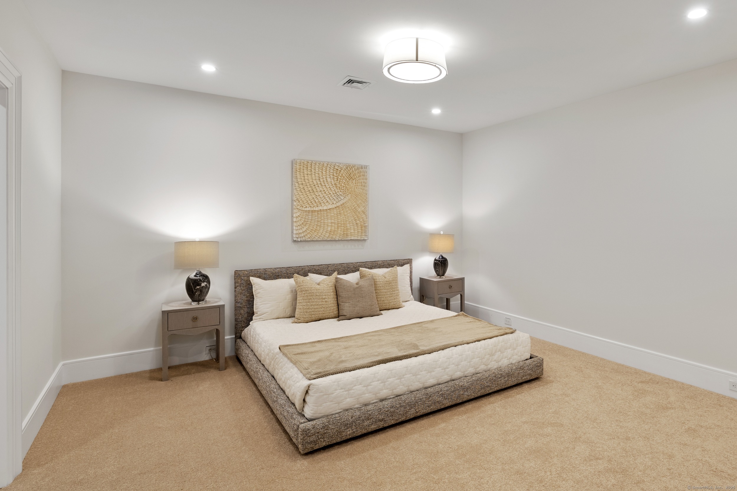 32 Webb Road Westport, CT 06880 - Photo 21 of 40 a bed room with a bed and a painting