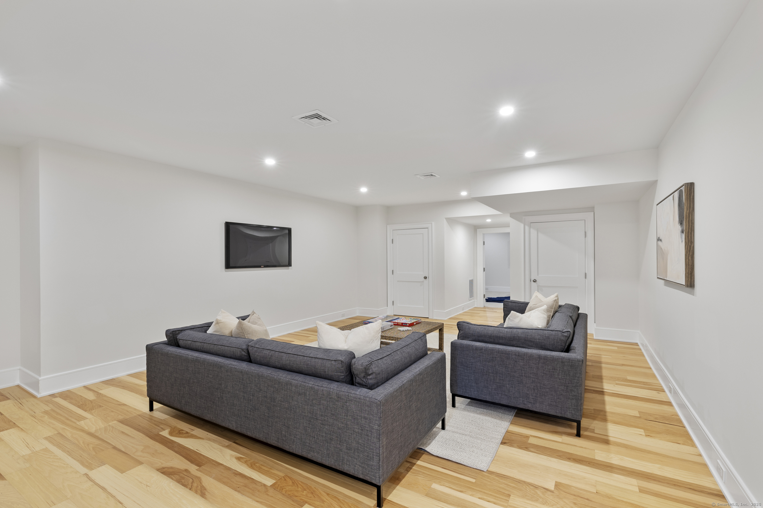 32 Webb Road Westport, CT 06880 - Photo 22 of 40 a living room with furniture and a wooden floor