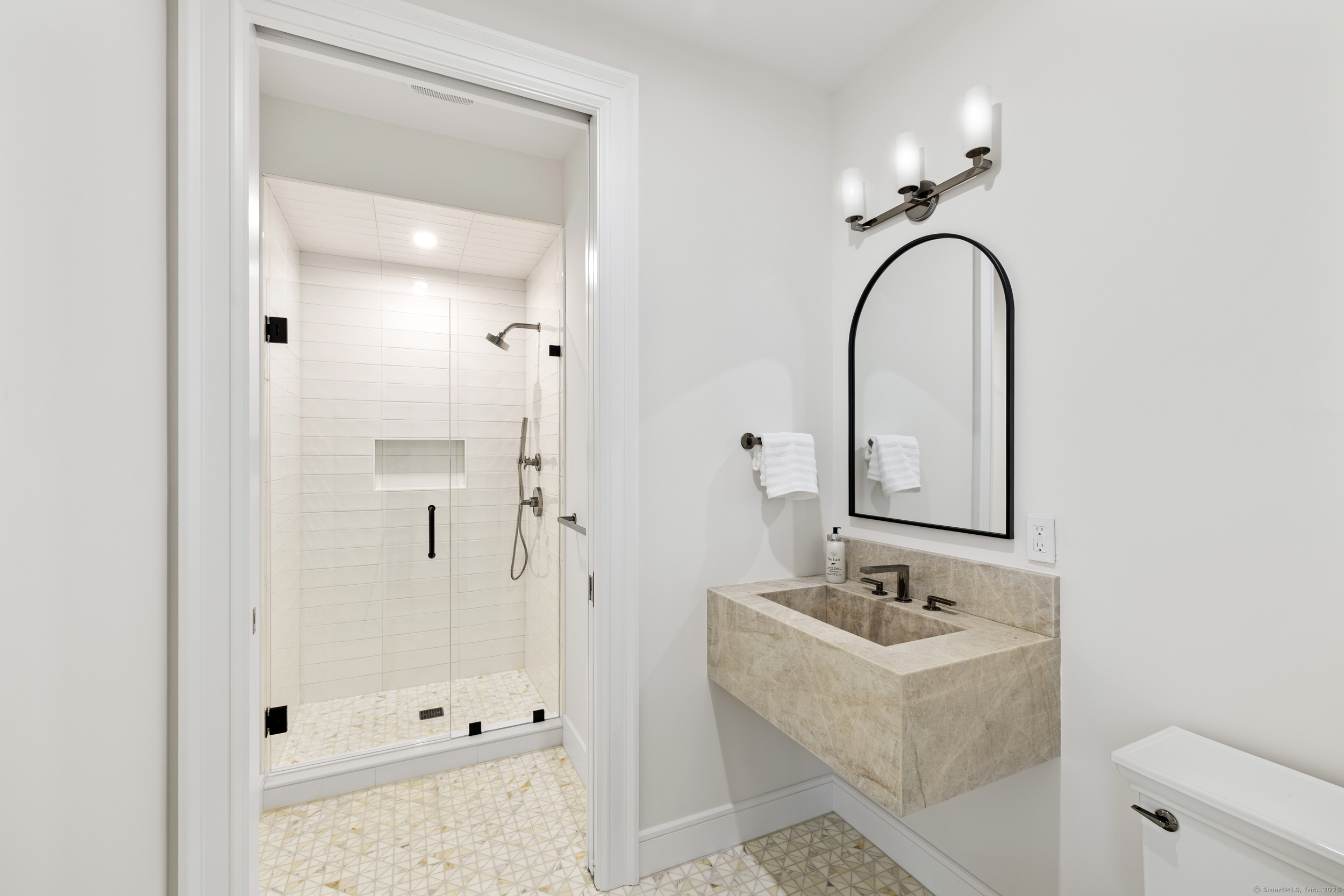 32 Webb Road Westport, CT 06880 - Photo 23 of 40 a bathroom with a sink and mirror