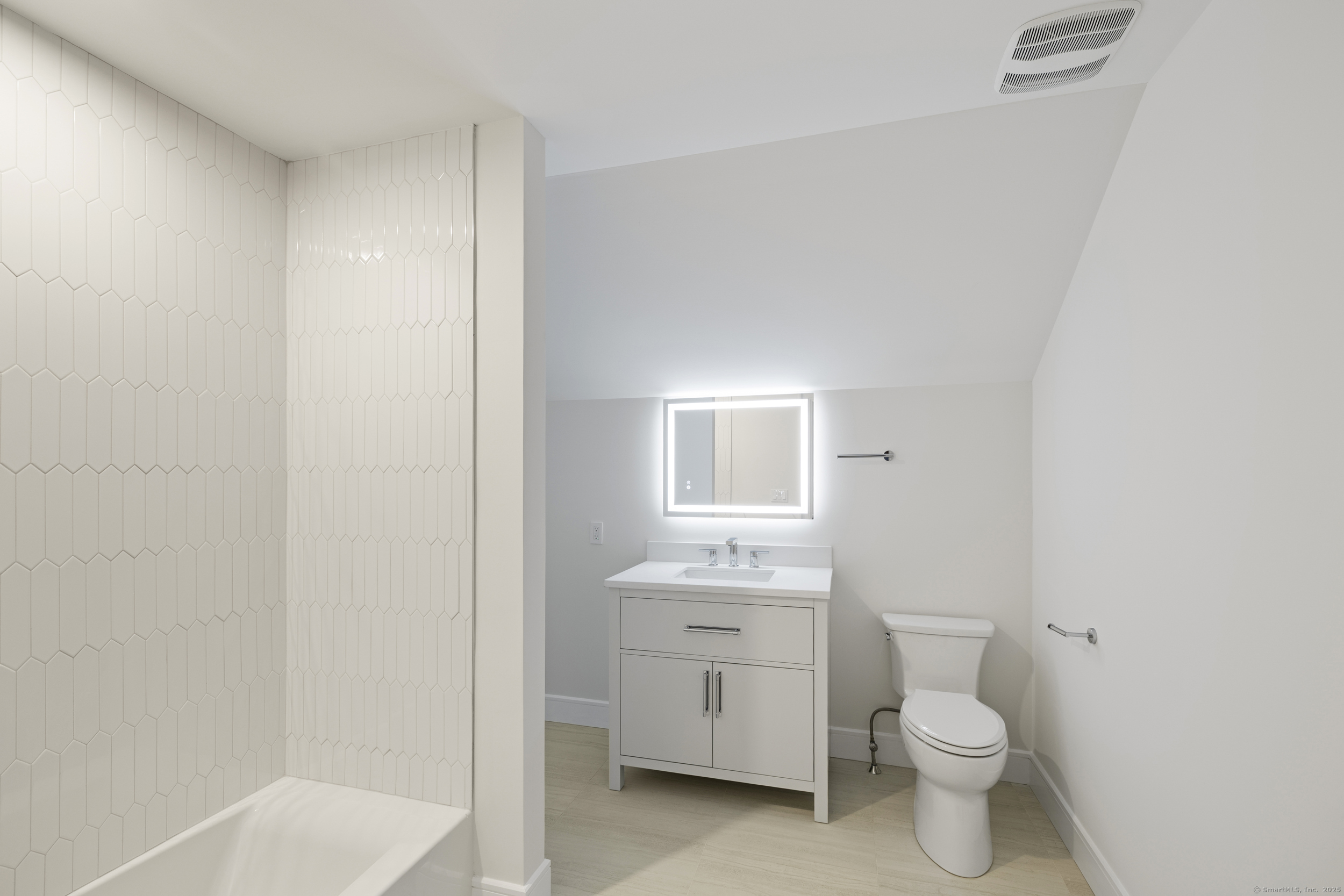 32 Webb Road Westport, CT 06880 - Photo 24 of 40 a bathroom with a toilet a sink and a mirror