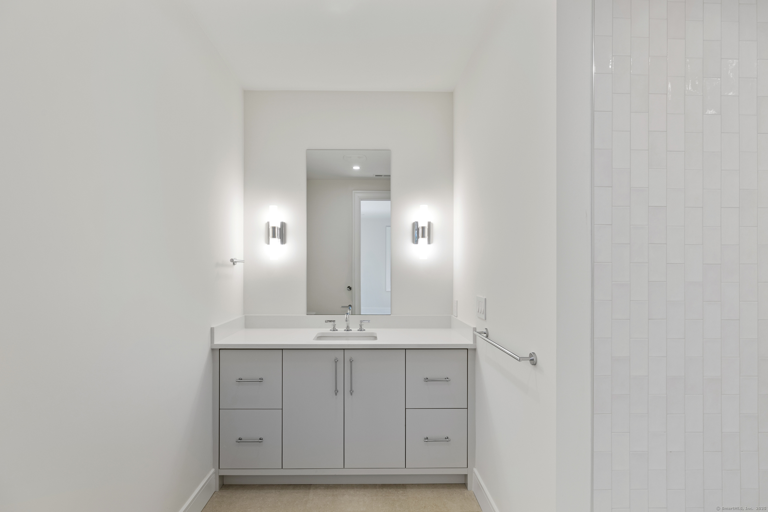 32 Webb Road Westport, CT 06880 - Photo 25 of 40 a bathroom with a sink and a mirror