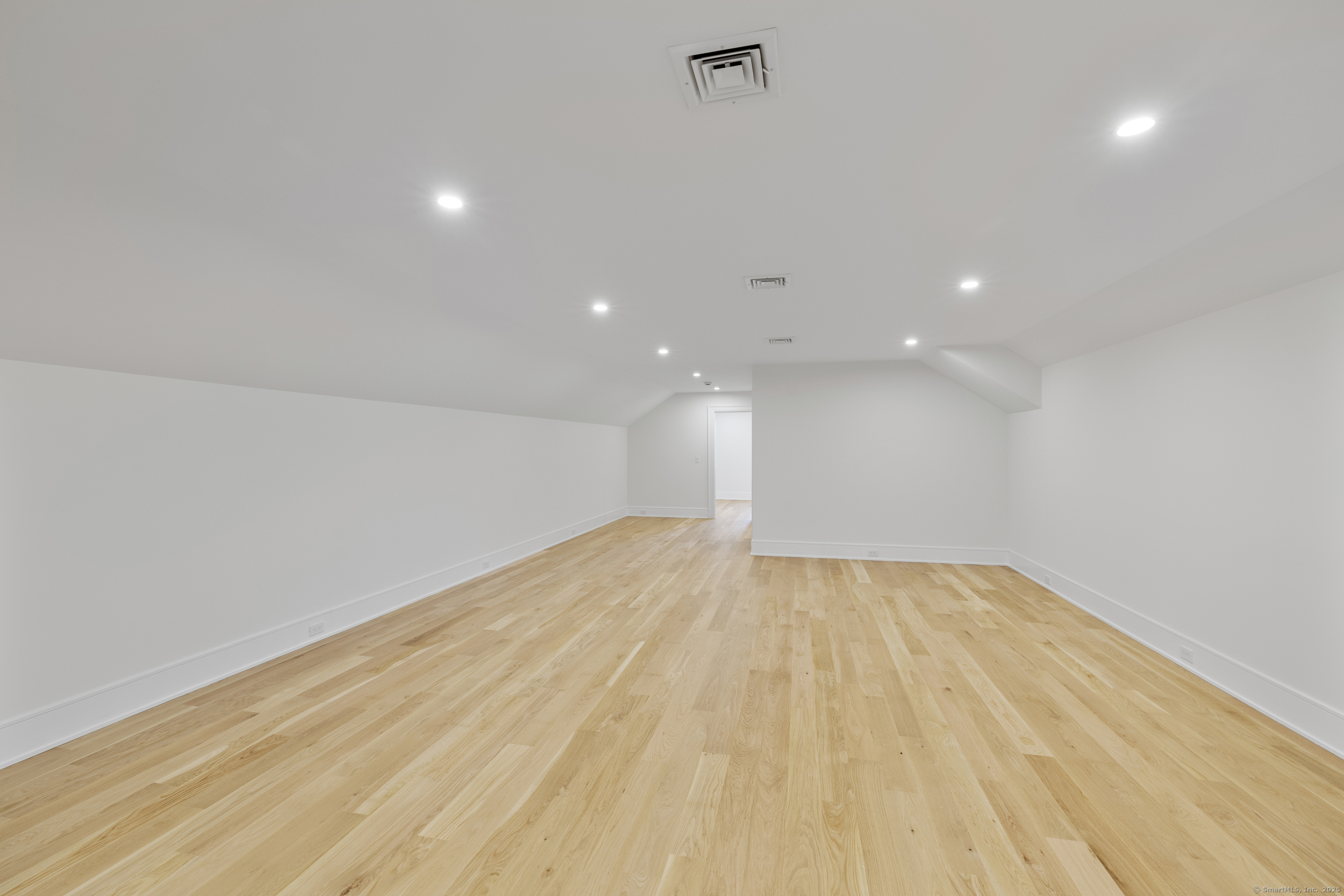 32 Webb Road Westport, CT 06880 - Photo 30 of 40 a view of an empty room with wooden floor